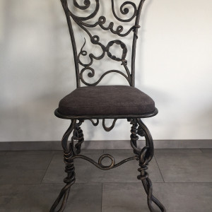 A wrought iron chair Root - luxury furniture