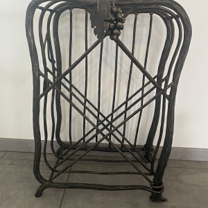 A wrought iron wine cabinet