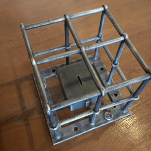 A wrought iron contribution box