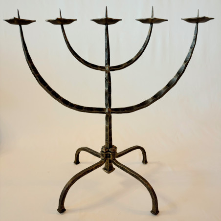 A wrought iron five-armed candelabra