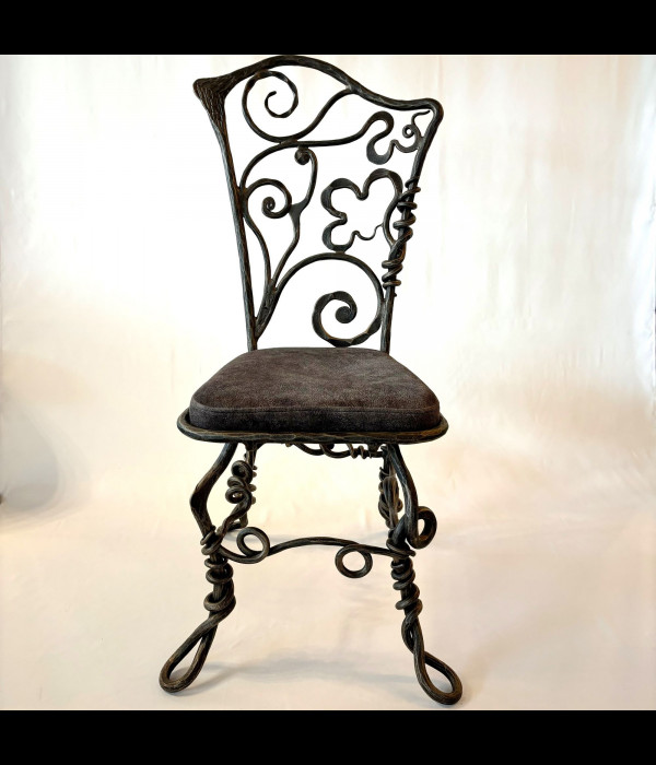 A wrought iron chair Root - luxury furniture