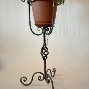 A wrought iron flowerpot
