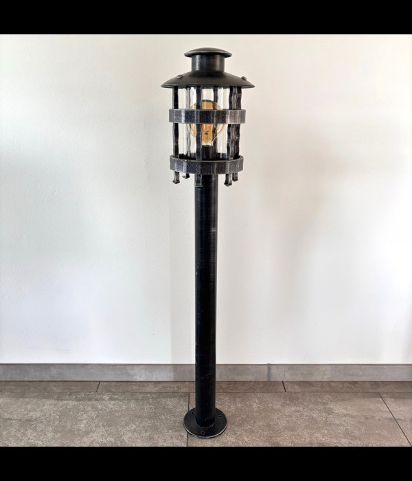 A wrought iron standard lamp Historical