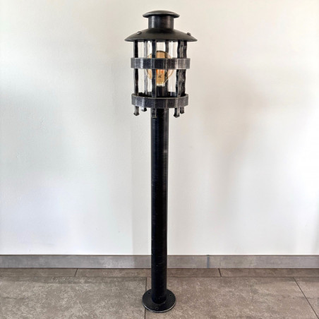 A wrought iron standard lamp Historical