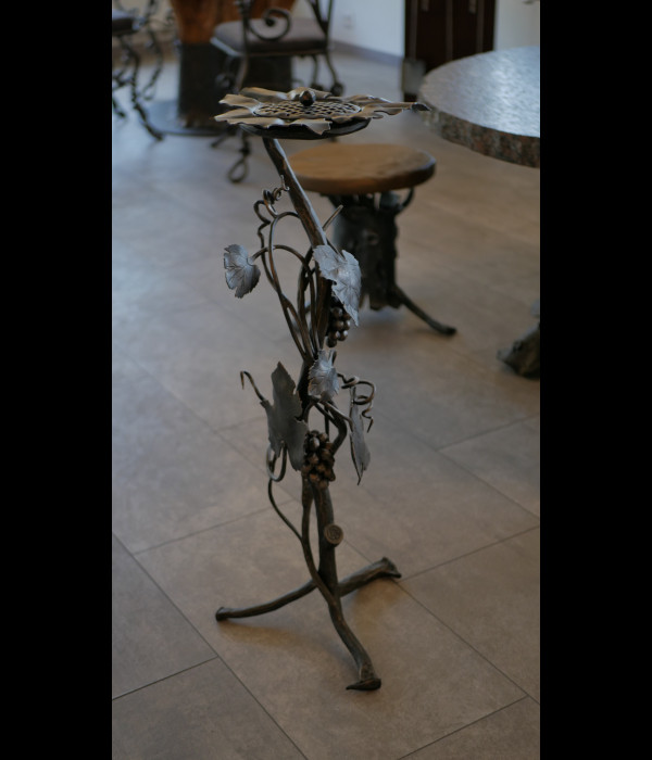 A wrought iron ashtray