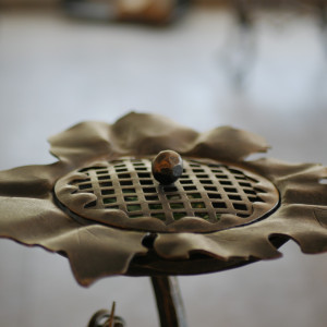 A wrought iron ashtray