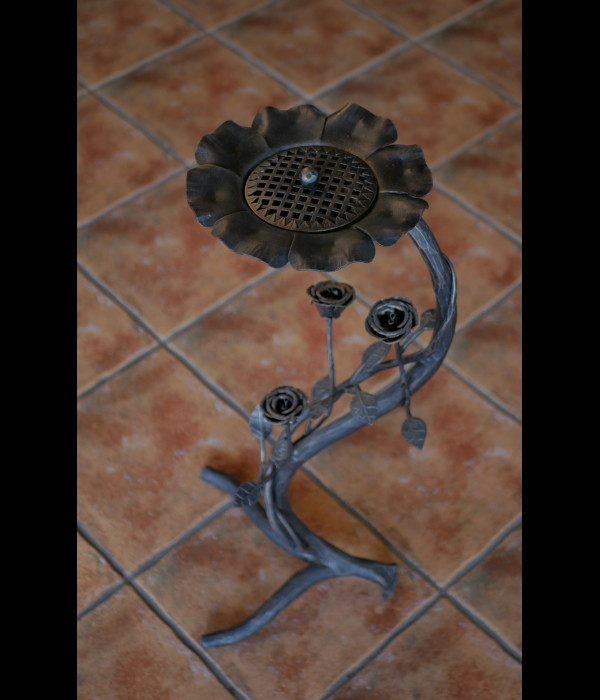 A wrought iron ashtray