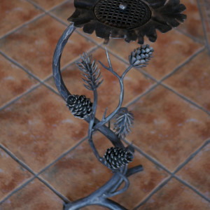 A wrought iron ashtray