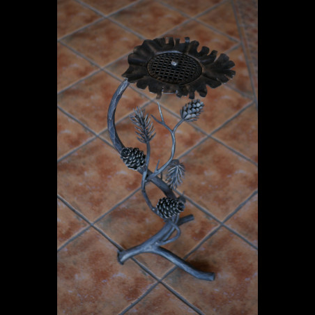 A wrought iron ashtray