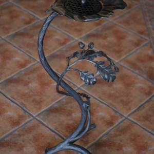 A wrought iron ashtray