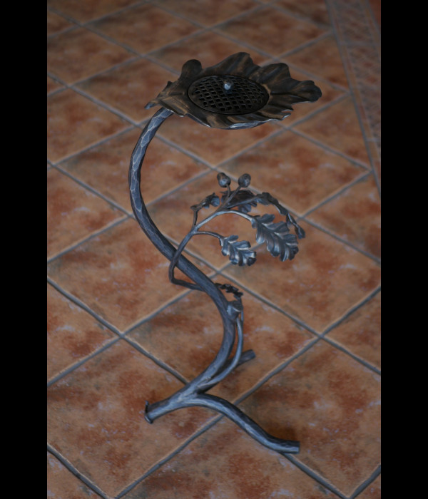 A wrought iron ashtray