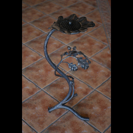 A wrought iron ashtray