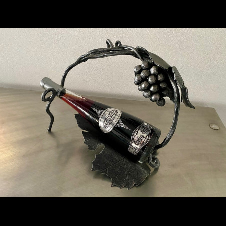 A wrought iron bottle holder