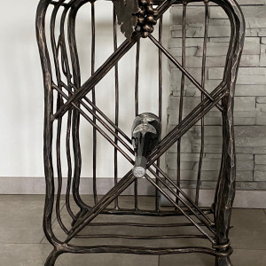 A wrought iron wine cabinet