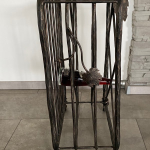 A wrought iron wine cabinet