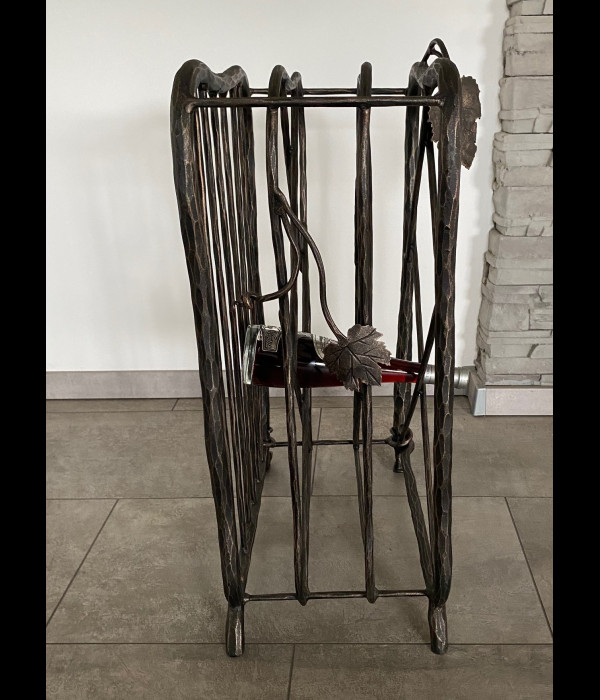 A wrought iron wine cabinet