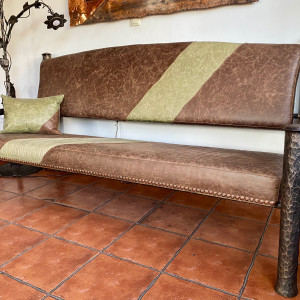 A wrought iron bench - luxury furniture