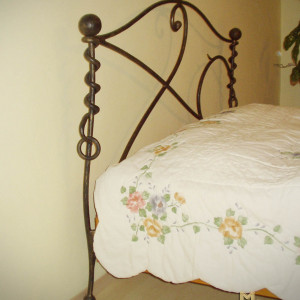 A wrought iron bed - hand-forged bedroom furniture (NBK-260)