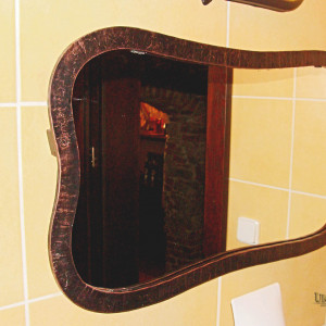 A mirror with a wrought iron frame  (NBK-306)