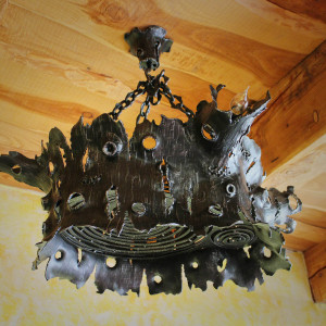 A wrought iron chandelier - an oak stump - an interior light (SI0313)